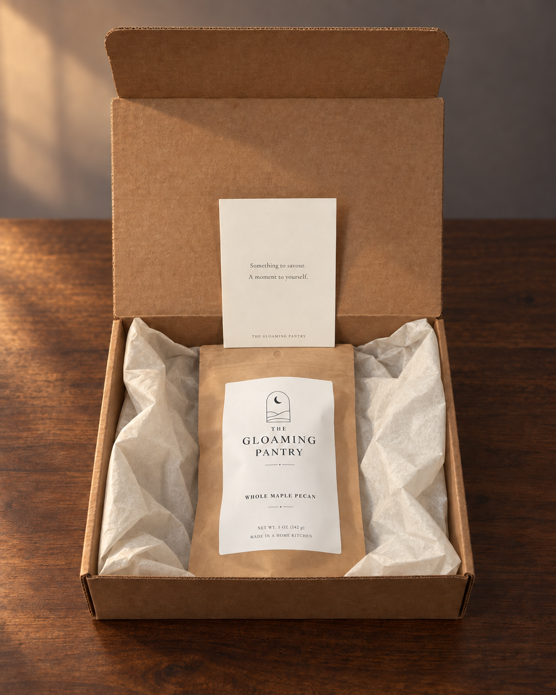 Whole Maple Pecan pouch and brand card in an open kraft box